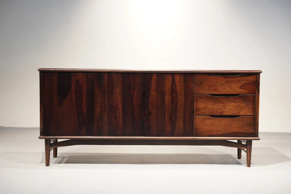 Mid-century modern wooden sideboard with a dark walnut finish, featuring three cabinet doors on the left and three drawers on the right, supported by angled legs.